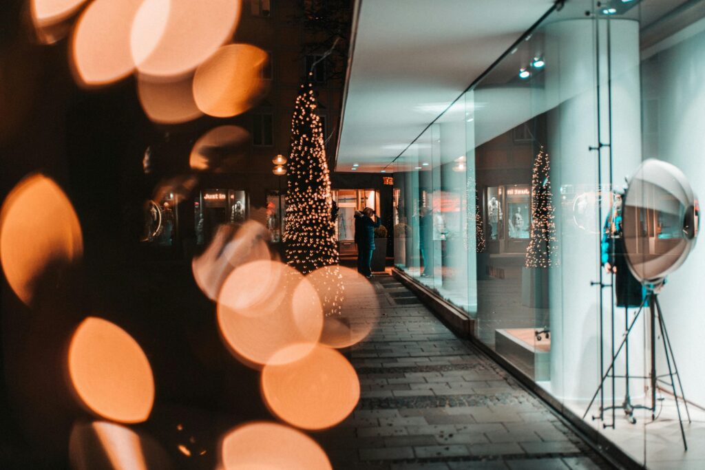 A retail walkway decorated for the holiday season.